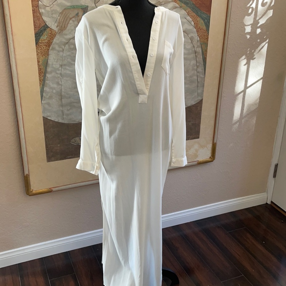 A woman’s dress white size large The fabric is a soft gosh type never been worn